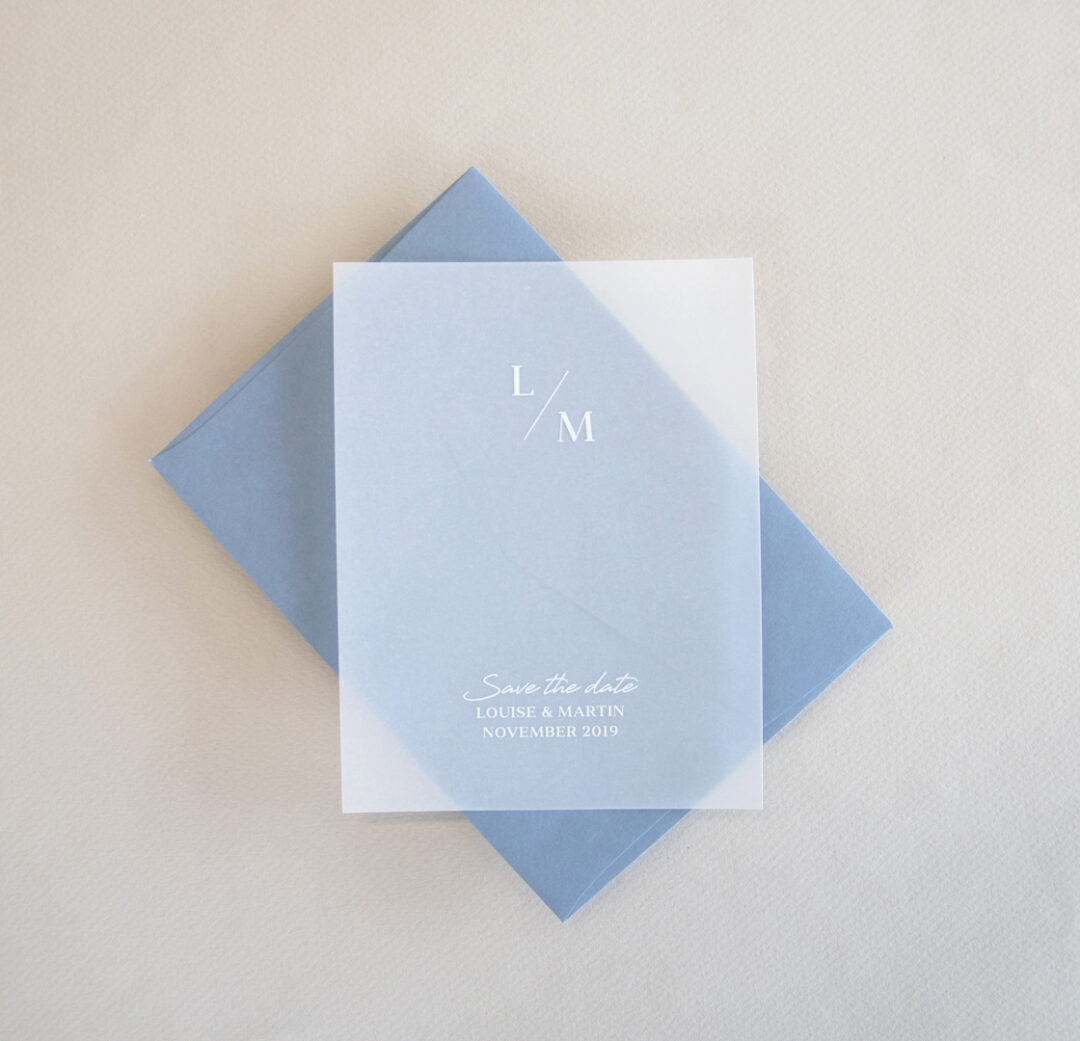 Adore save the date card - translucent vellum with white ink on dusty blue envelope