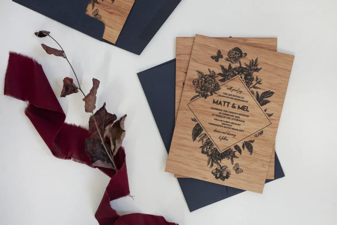 boxed wedding invitation sealed with ribbon bow on marble surface - exterior presentation wedding stationery