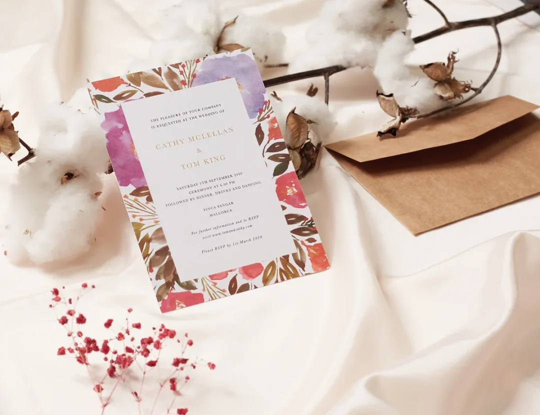 destination wedding invitation suite with tropical botanical design and kraft envelope - flat lay wedding stationery
