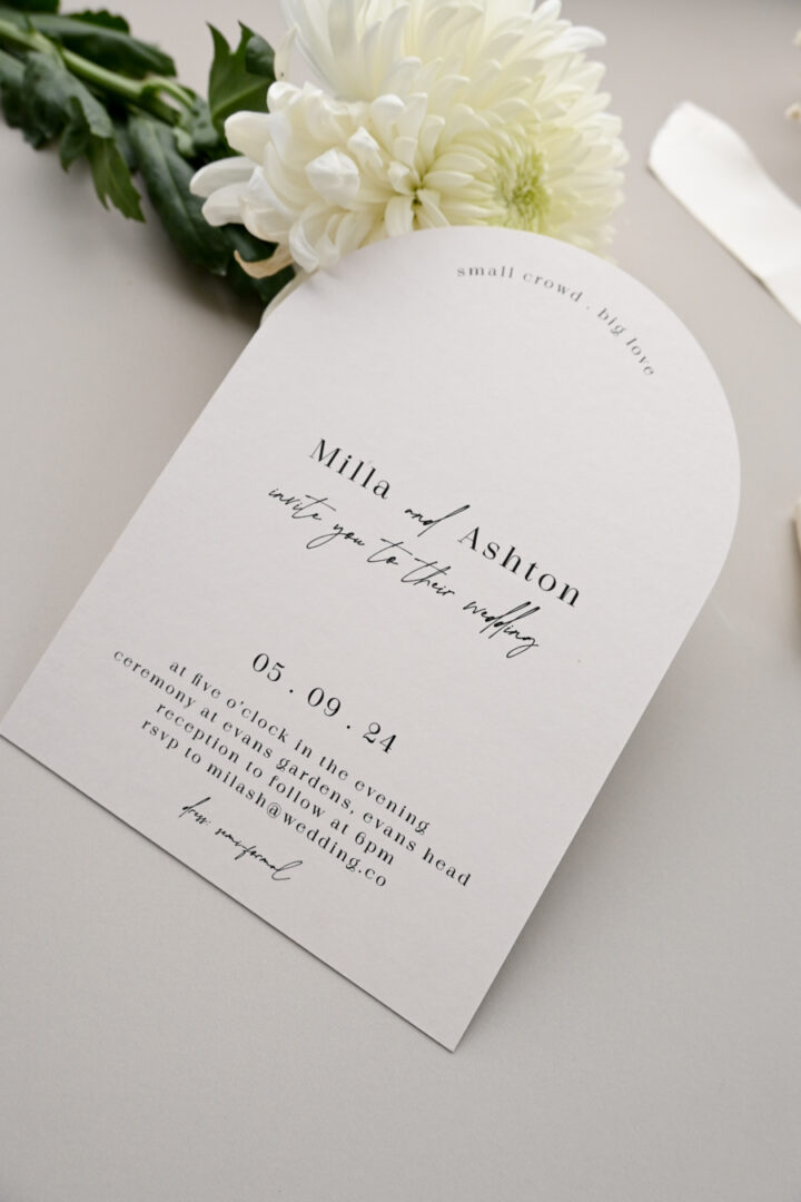 Minimalist arch wedding invitation with small crowd big love tagline