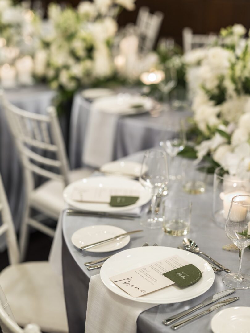 Wedding reception tablescape with coordinated stationery including menu card and place card