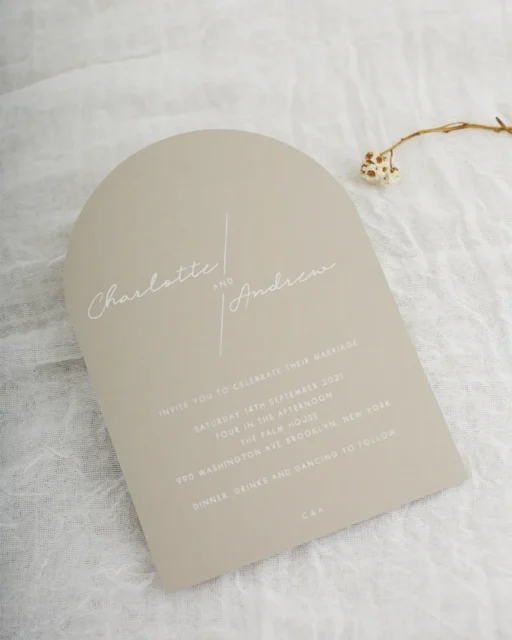 Wedding invitation printing techniques — arch shaped card with white ink on warm taupe stock with minimalist design