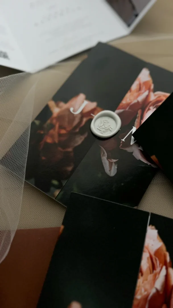 Lover era inspired wedding invitation suite in pink and gold with floral details and wax seal wedding stationery