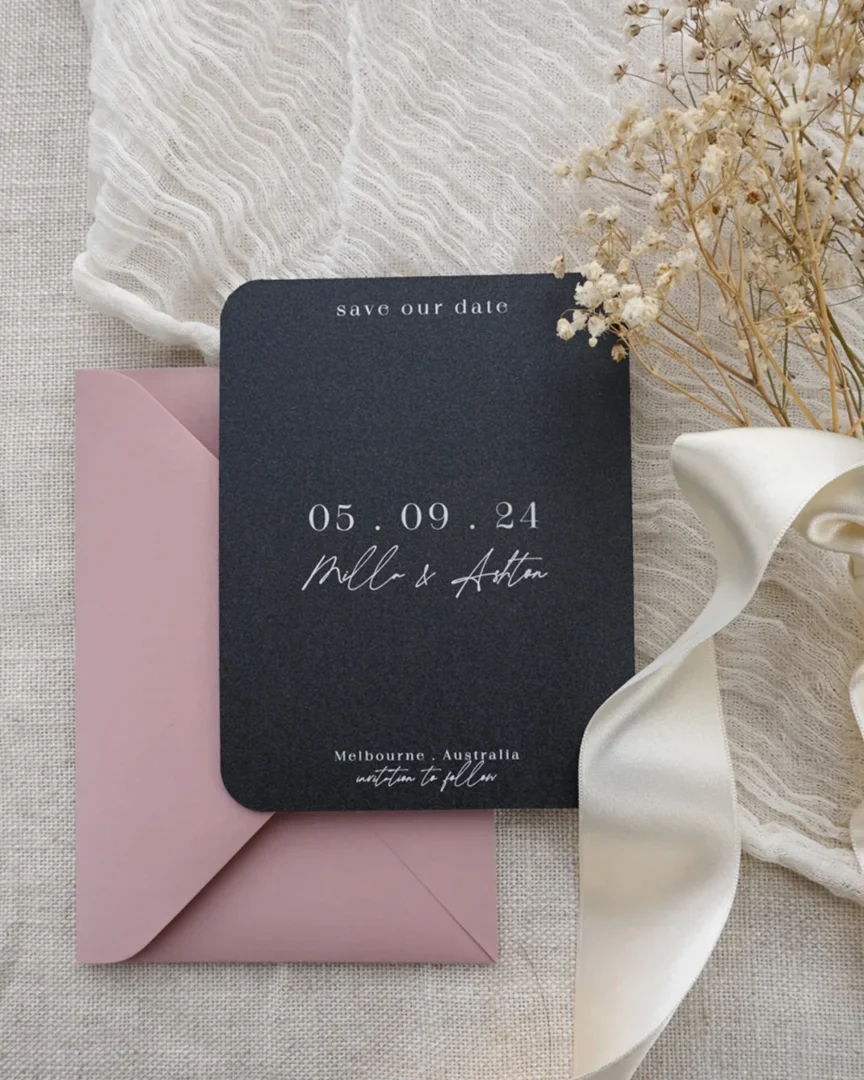 Dark charcoal save the date with white ink and dusty pink envelope