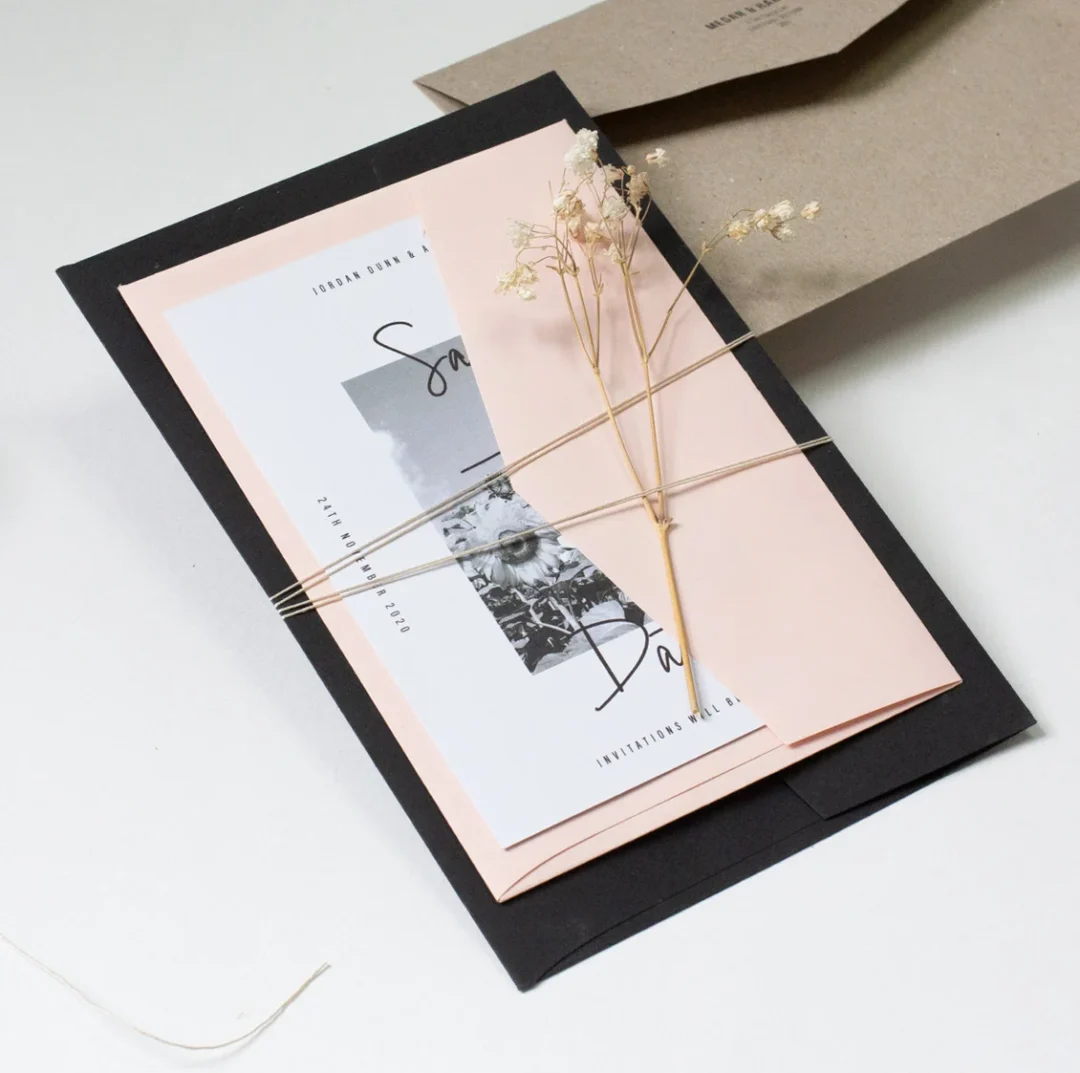 seed paper wedding invitation suite with kraft envelope and natural twine - flat lay on wooden surface wedding stationery