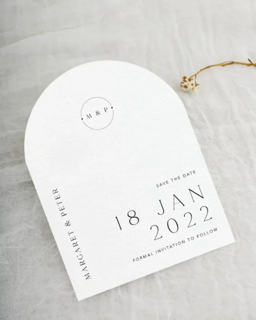 Minimalist arch save the date card with bold serif typography — modern wedding stationery