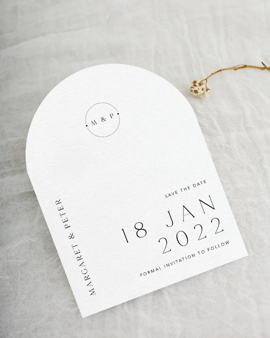 Minimalist arch save the date card with bold serif typography — modern wedding stationery