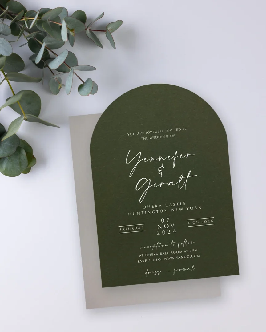 Forest green arch-shaped wedding invitation styled with eucalyptus — elegant Paperlust wedding invitation design
