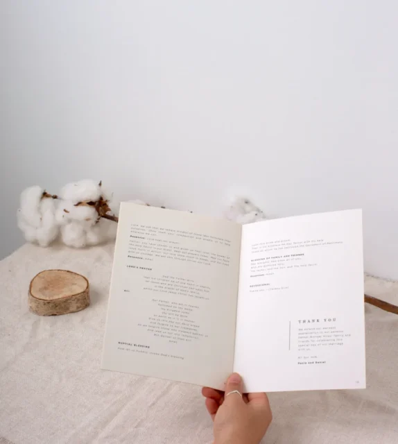 Open wedding ceremony program booklet showing order of service interior pages: Paperlust wedding program booklets