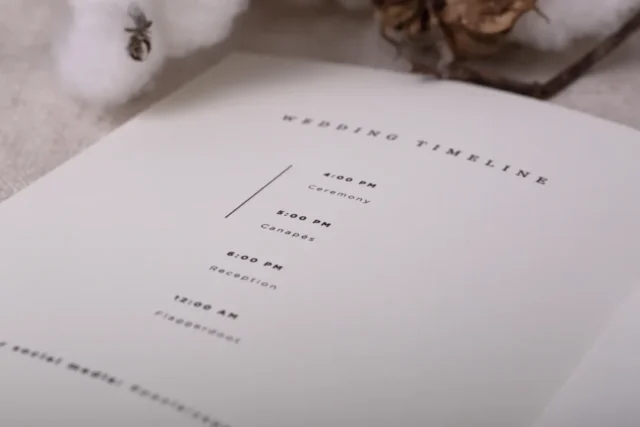 Wedding program booklet open to the wedding timeline page — ceremony order of service