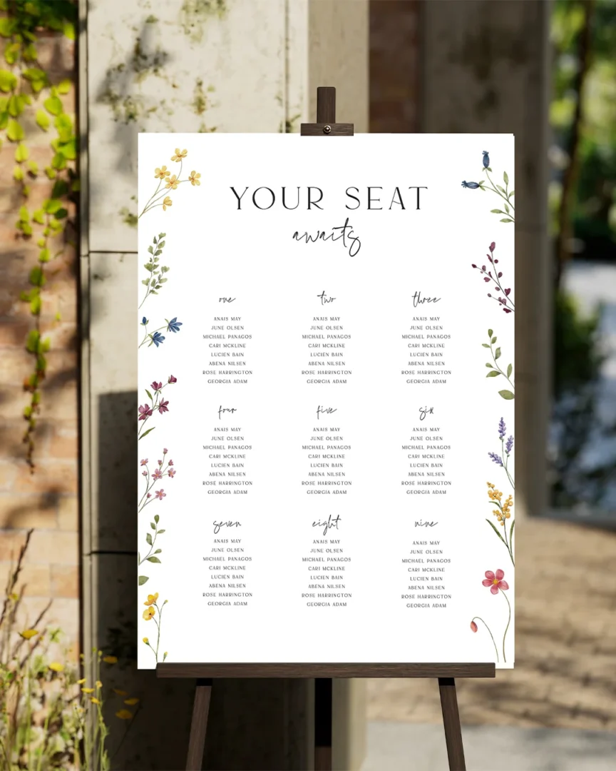 Wedding seating chart display — Your Seat Awaits calligraphy board with guest name assignments