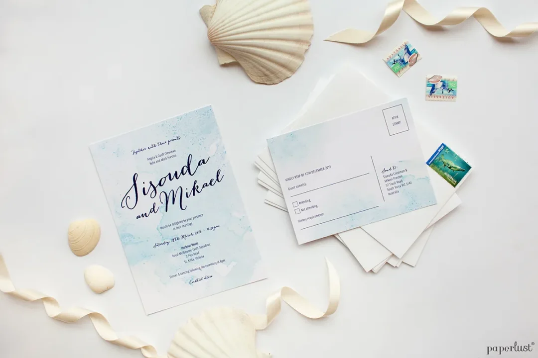 Beach destination wedding invitation suite with watercolour coastal design