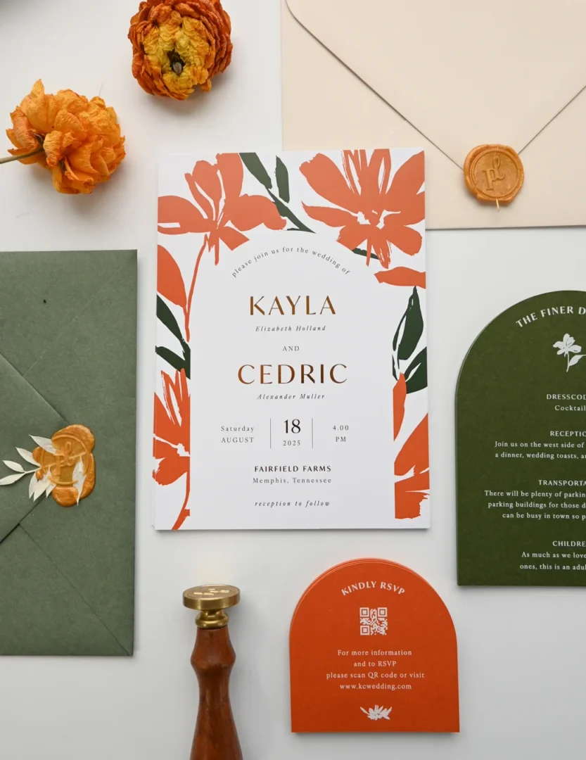 a luxury rigid-lid invitation box open on a white surface, showing a cream invitation suite with floral liner and wax seal visible inside, photographed from above wedding stationery