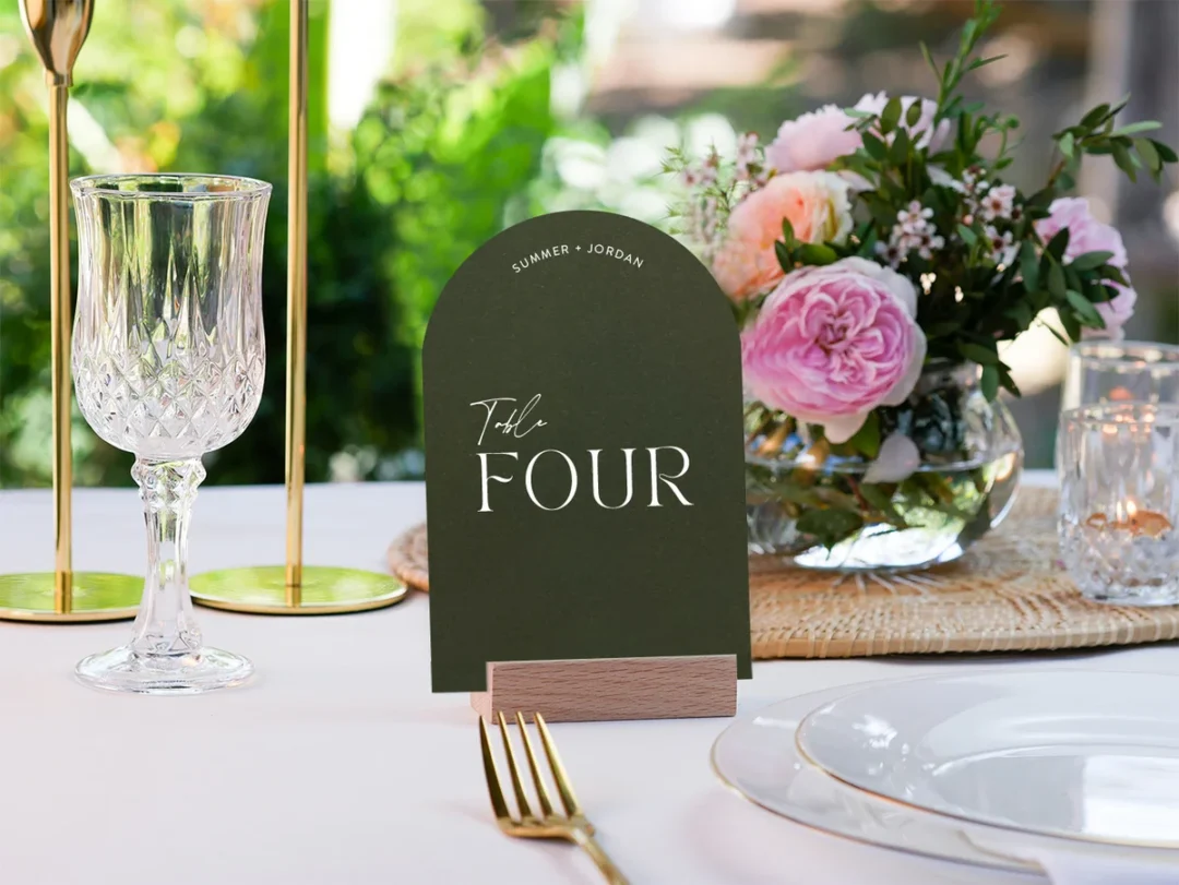 couple at vow renewal ceremony surrounded by close family, milestone anniversary, garden or intimate venue, candid warmth and joy visible wedding stationery