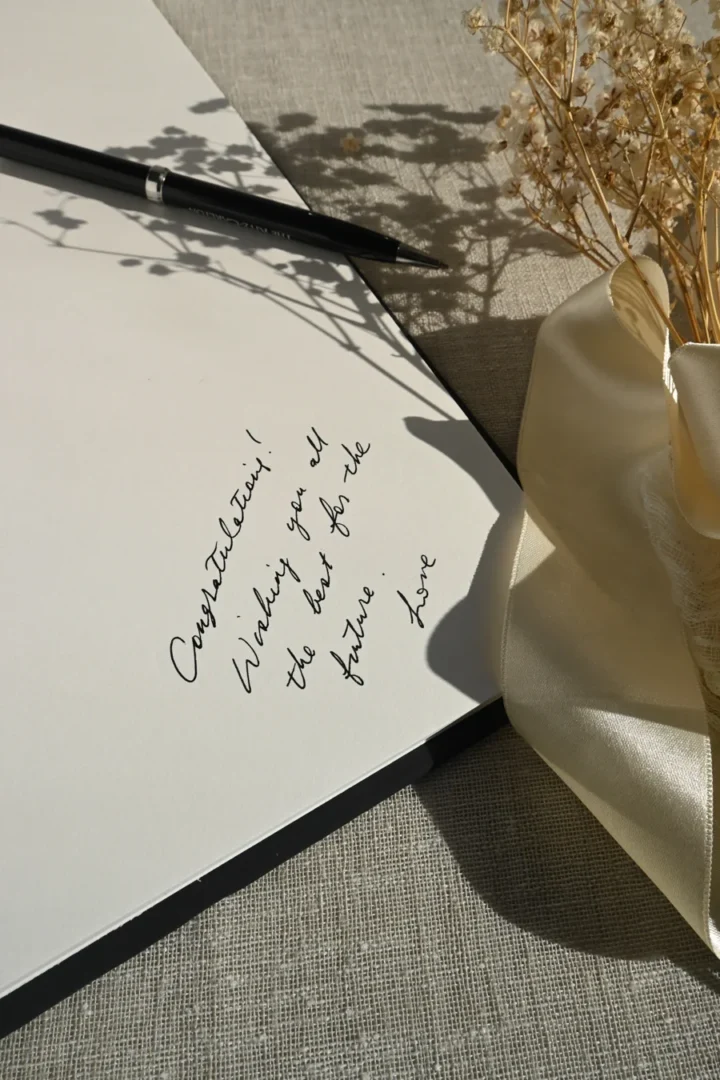 couple sitting together reviewing handwritten notes, laughing, casual home setting with afternoon light - vow writing and rehearsal in progress wedding stationery