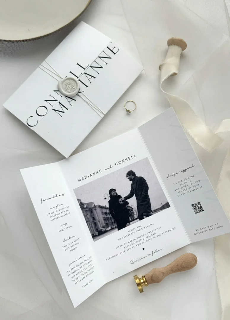 Elegant framed custom art print on a living room wall - song lyrics or wedding vows in calligraphy, warm interior light, couple's keepsake wall art wedding stationery