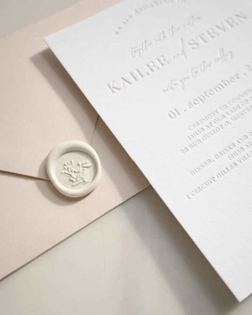 Wedding invitation suite components laid out showing invitation, RSVP card, details card, outer and inner envelopes wedding stationery