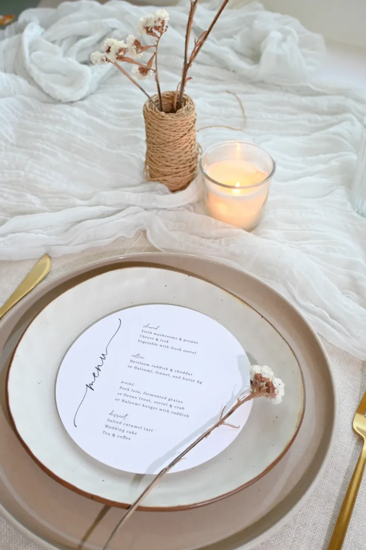 women playing wedding charades at a bridal shower, one woman acting out a word while others guess enthusiastically, casual living room setting with decorations wedding stationery