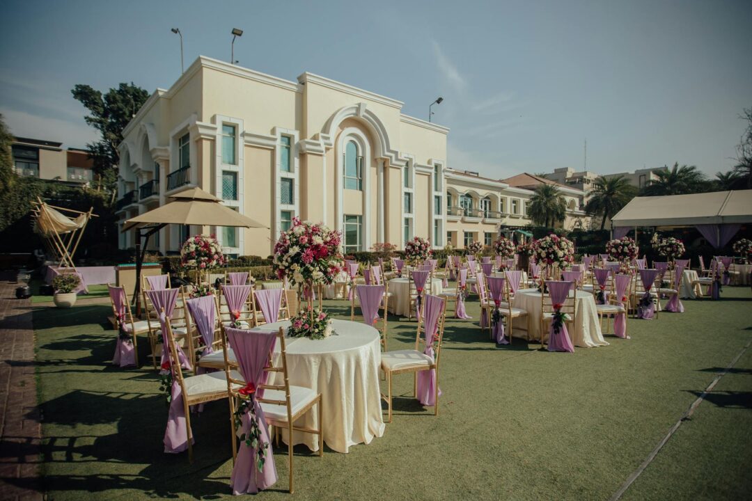 bright daytime brunch wedding reception setup with pastel florals, mimosa glasses, white linens, and sunny natural light
