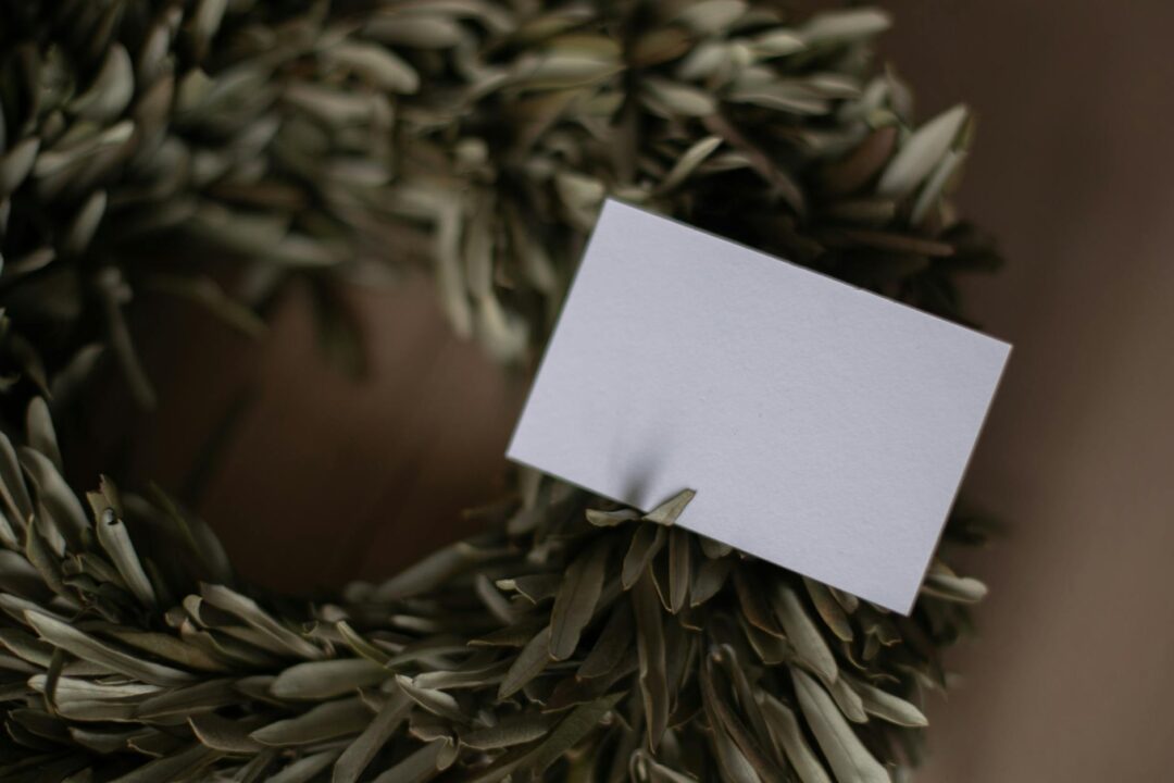 Paperlust wedding invitation details card close-up showing a small QR code alongside wedding website URL, clean modern typography on white
