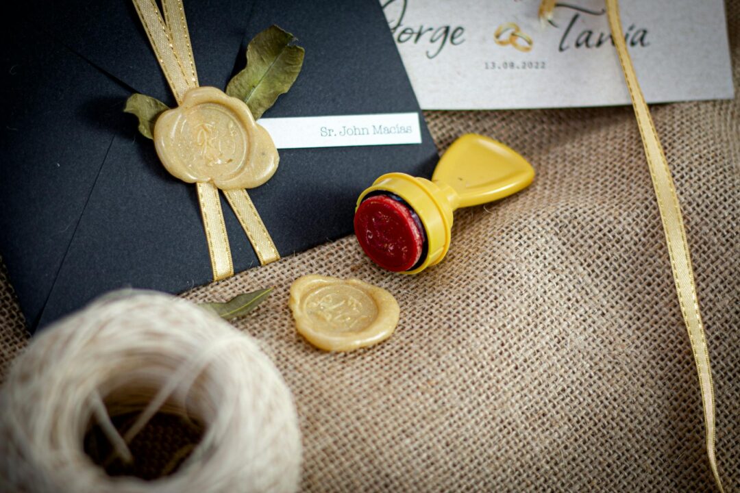 Paperlust wedding invitation suite flatlay showing complete set, invitation, details card, RSVP card, and addressed envelope with wax seal