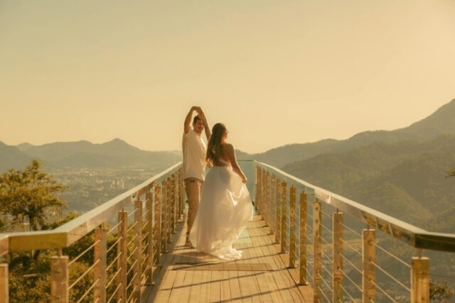 Couple exchanging vows at scenic mountain overlook