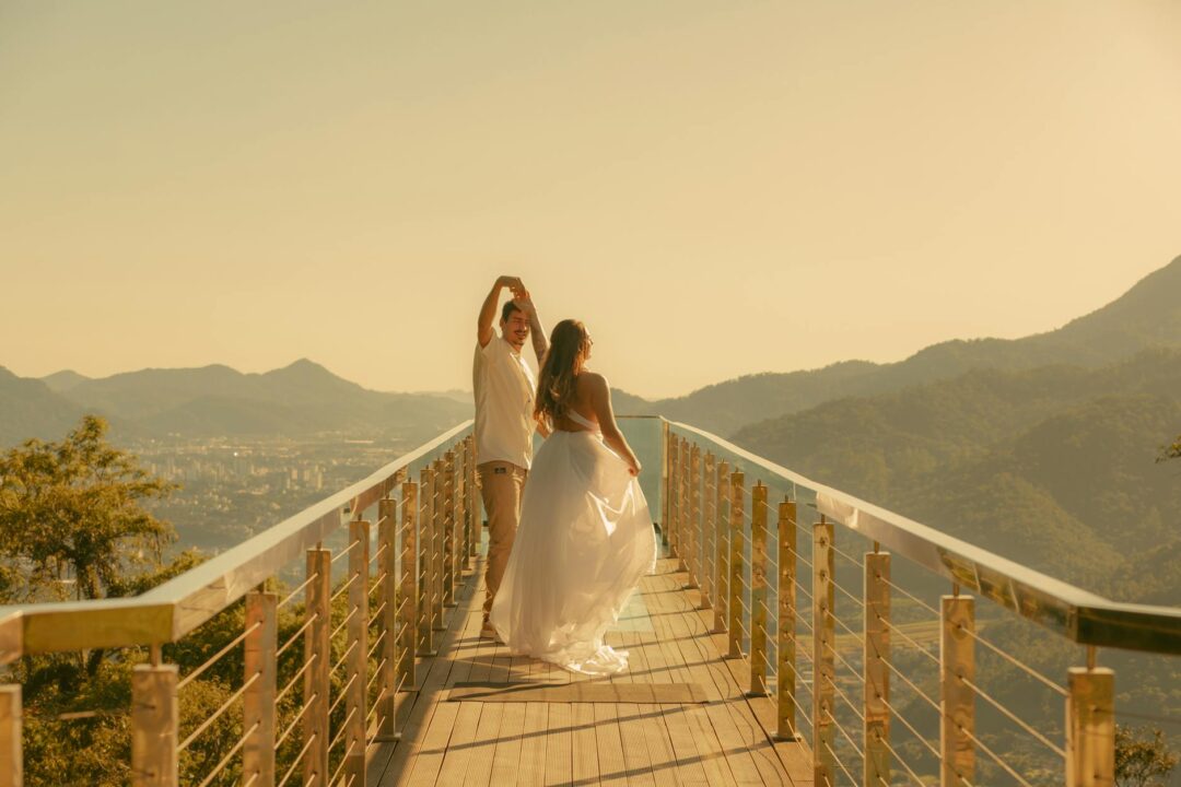 Couple exchanging vows at scenic mountain overlook