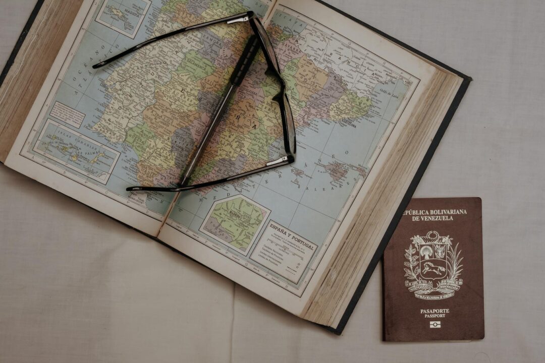 Passport and marriage license documents on wooden desk