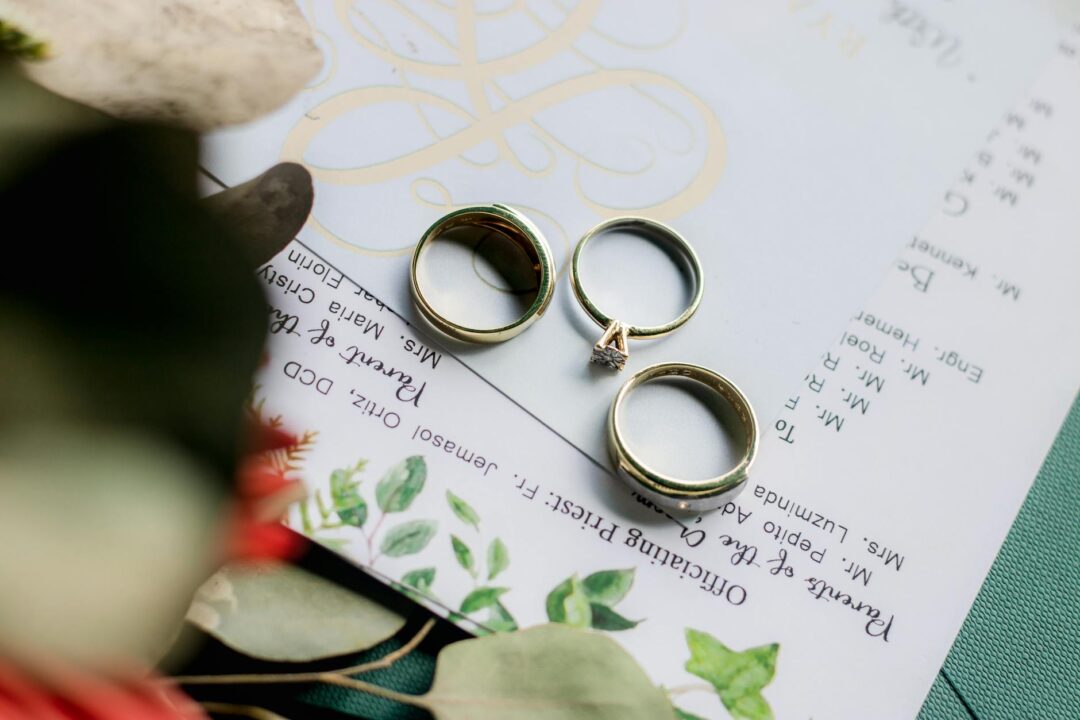 Elegant wedding stationery suite with RSVP card, invitation card, and envelope arranged as a flat lay on a light marble surface
