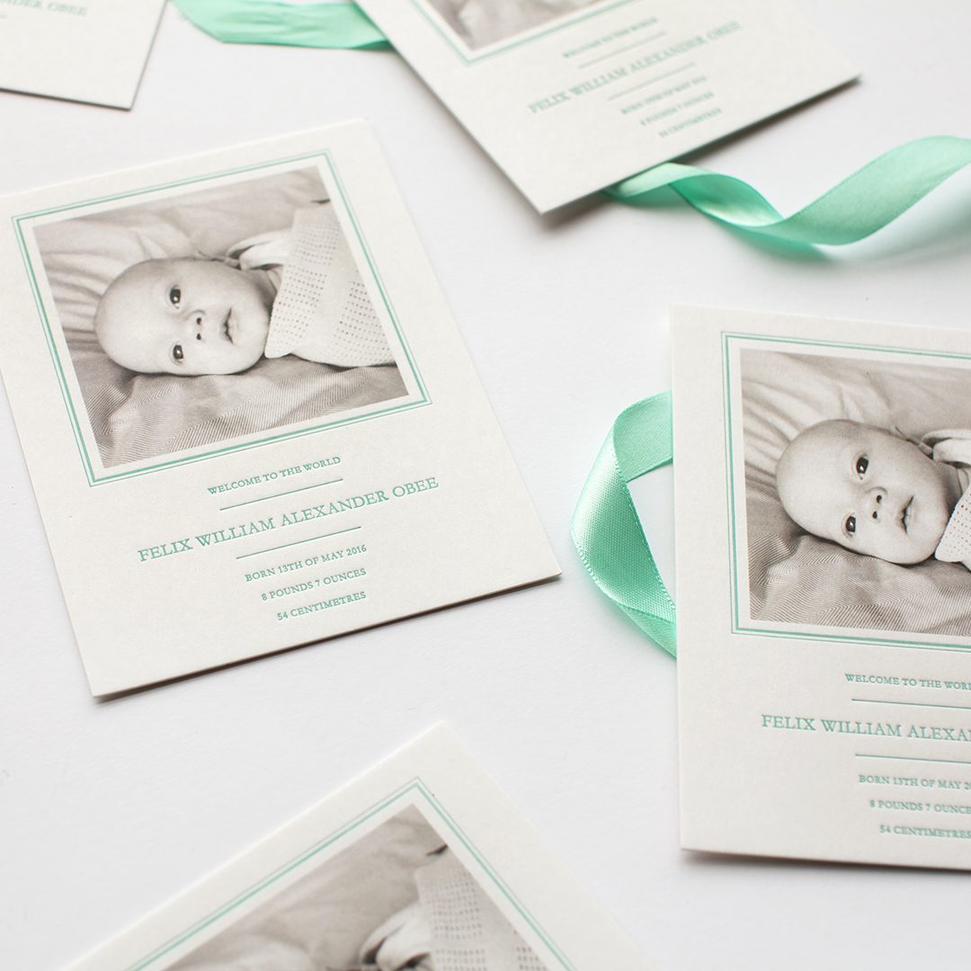 Paperlust square birth announcement cards with black-and-white baby photo and mint green typography, announcing the arrival of Felix William