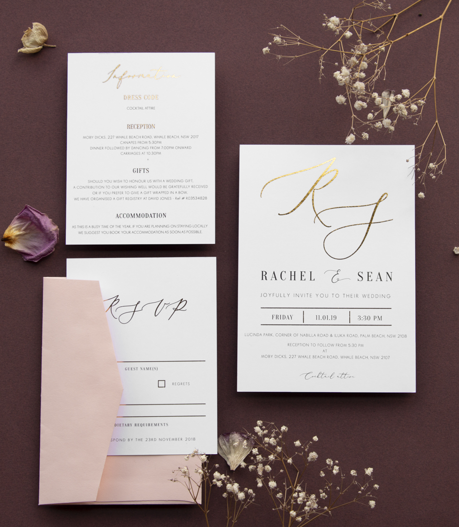 Paperlust burgundy and blush wedding invitation suite, white invitations with gold foil monogram on a deep burgundy background, blush pink envelope, dried baby's breath