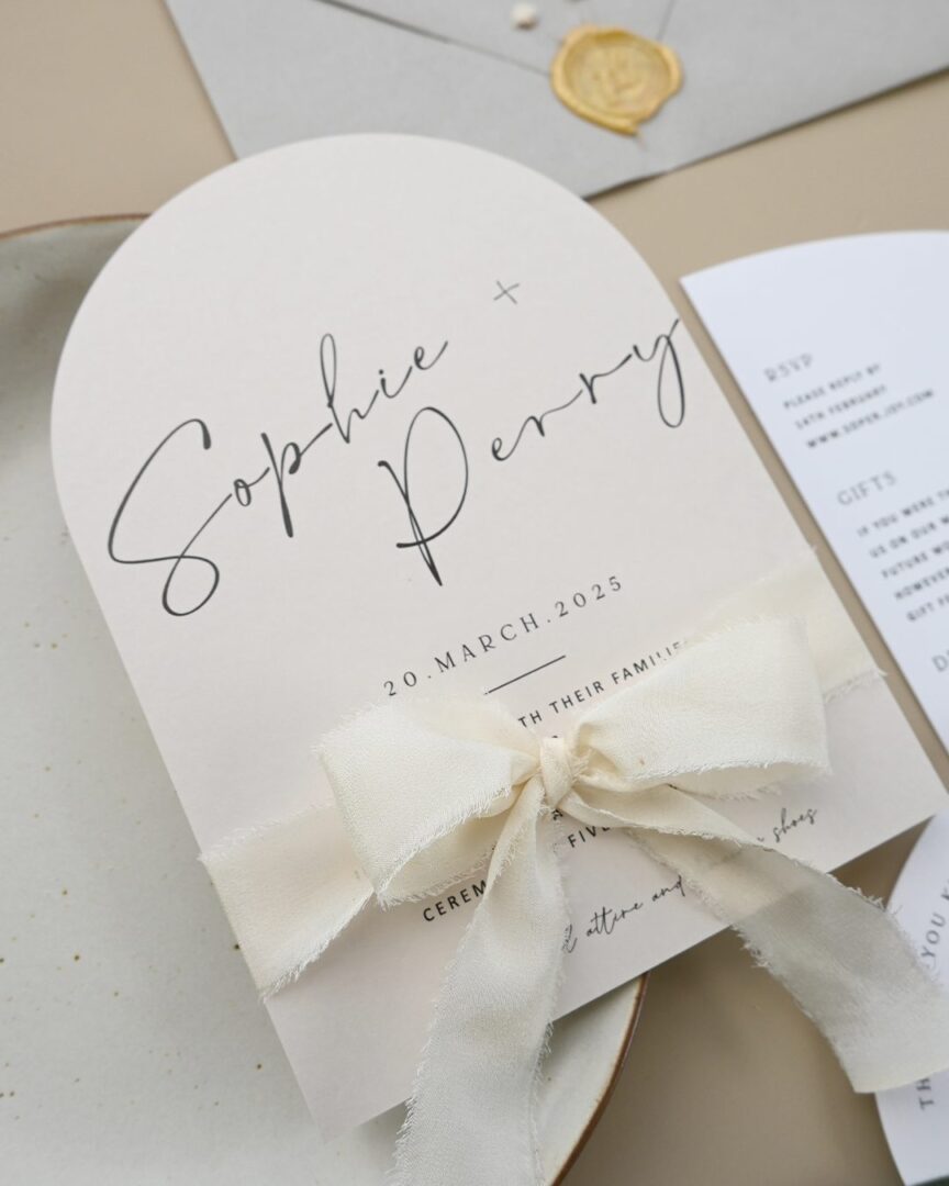 Paperlust Harmony arch wedding invitation showcasing full sculptural silhouette and warm neutral palette
