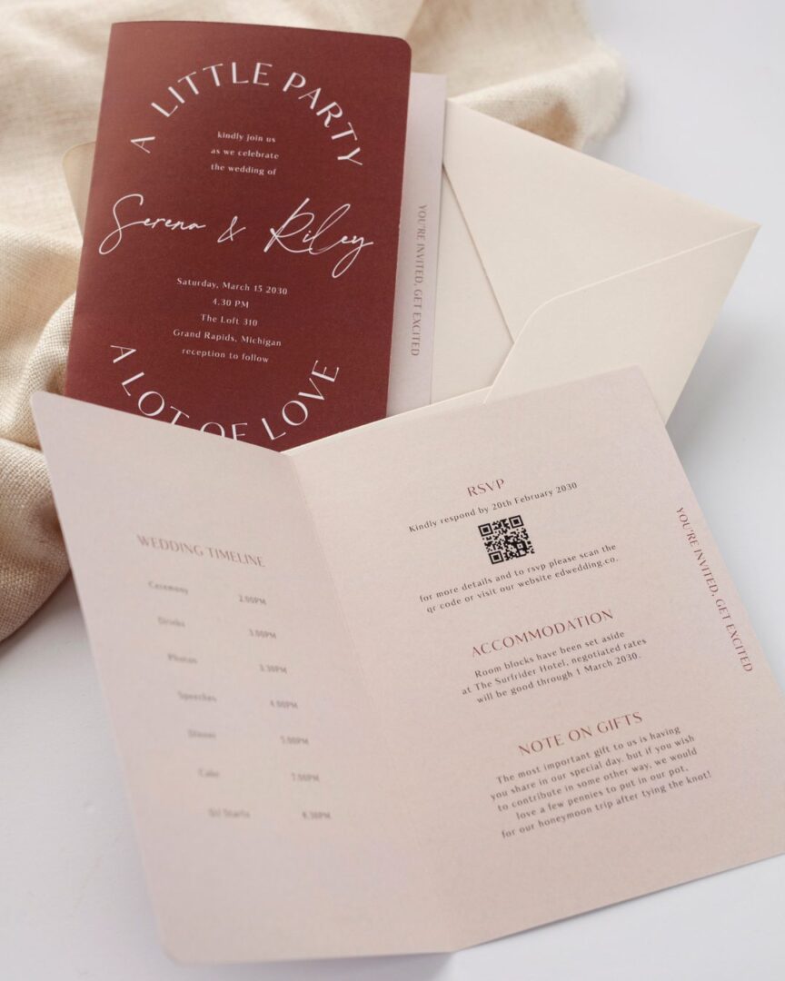 Paperlust Impressionist bifold wedding invitation on burgundy oxblood stock with white ink arched headline typography