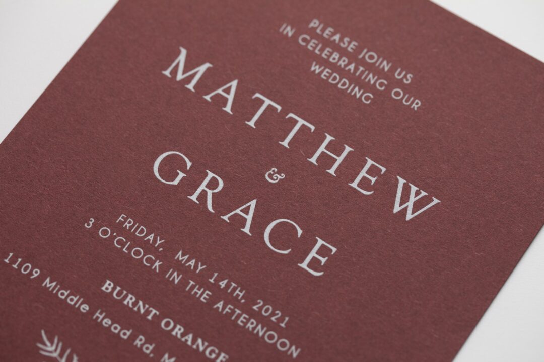Paperlust modern serif wedding invitation, deep burgundy cardstock with crisp white serif
