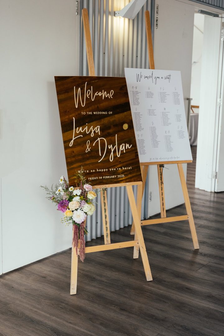 Paperlust welcome sign, Two signs on easels: wooden welcome sign for Luisa & Dylan dated Friday 14 February 2025