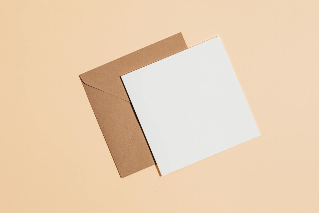 A set of three Paperlust birth announcement card designs displayed as a styled flatlay, one minimalist digital print in sage and white, one
