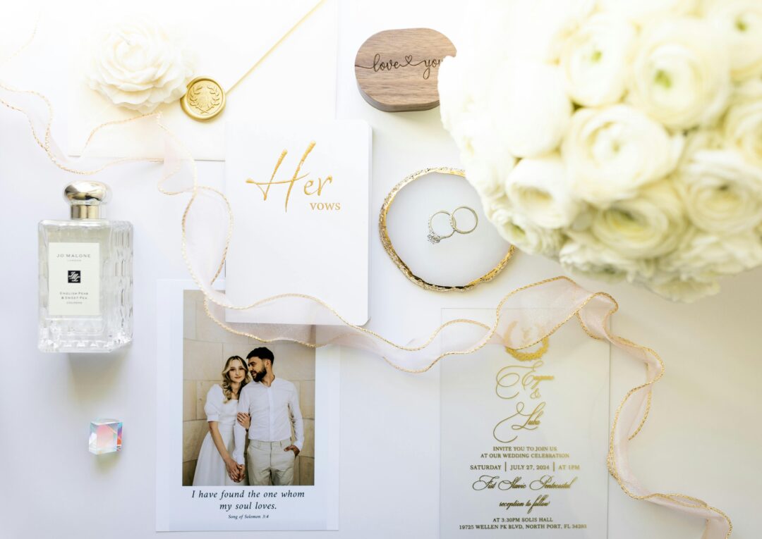 close-up of elegant vow card resting on a linen fabric surface next to wedding rings, soft natural light, stationery styling flat lay