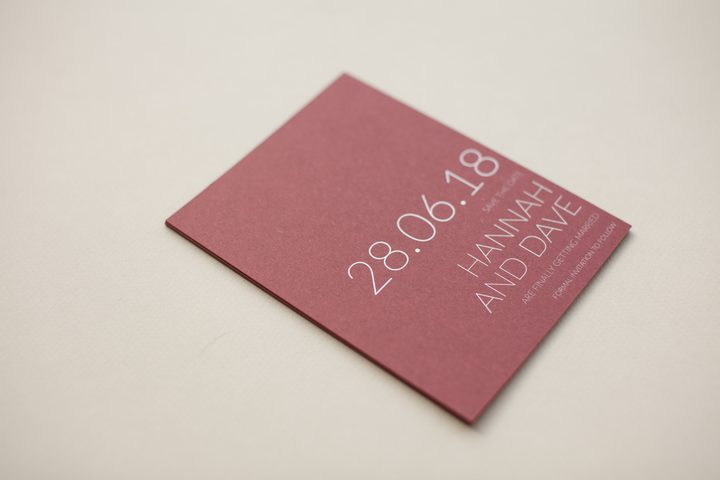 Paperlust raspberry red save the date card with bold typographic wording for Hannah and Dave