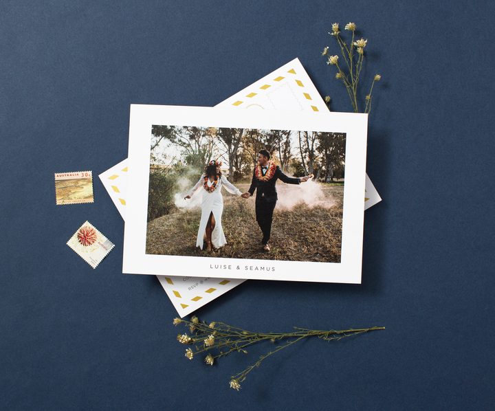 Paperlust navy save the date postcard with full-bleed couple photo featuring smoke bombs
