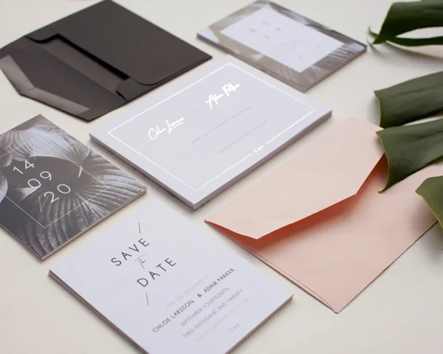 Paperlust modern tropical save the date stationery suite flat lay