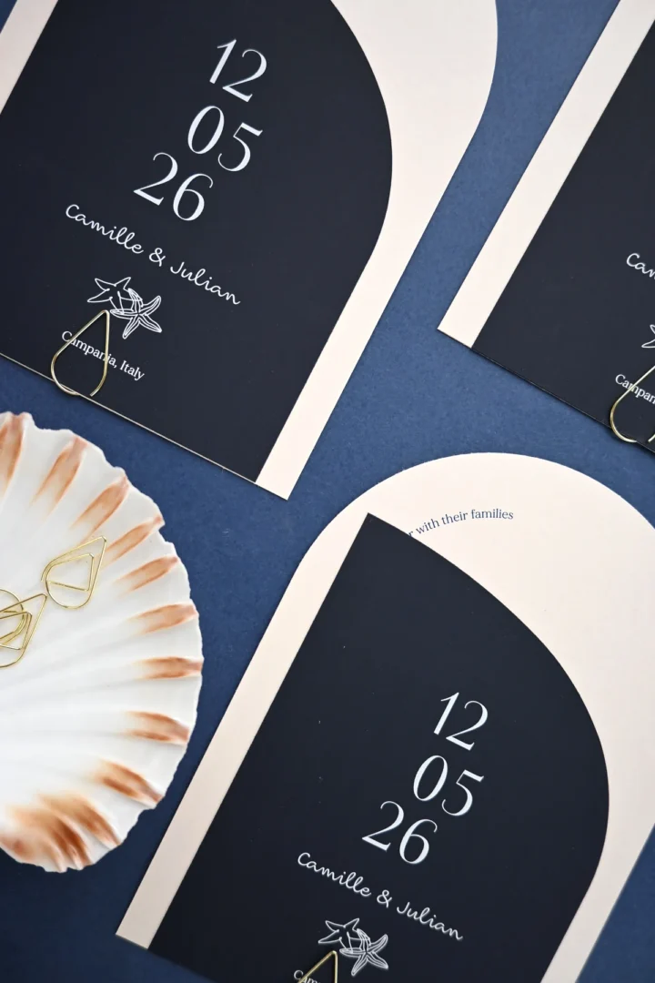 Paperlust navy and blush arch save the date for a Campania, Italy destination wedding, with a starfish motif and coastal seashell styling