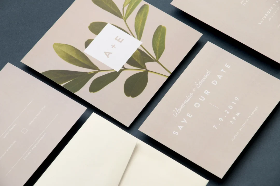 Paperlust botanical save the date stationery suite on dark background