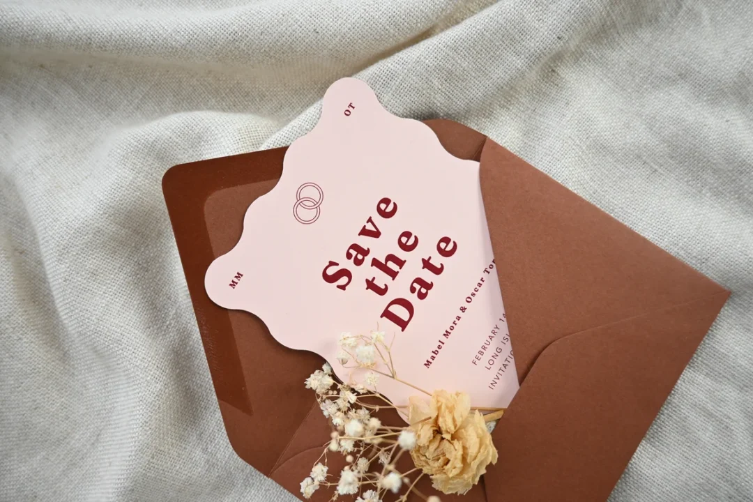 Paperlust scalloped save the date card with envelope and dried flowers