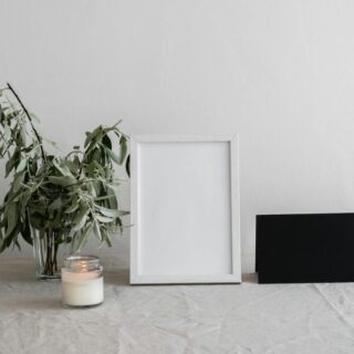Elegant printed wedding menu cards styled on a linen table setting with ceramic plates and floral centerpiece