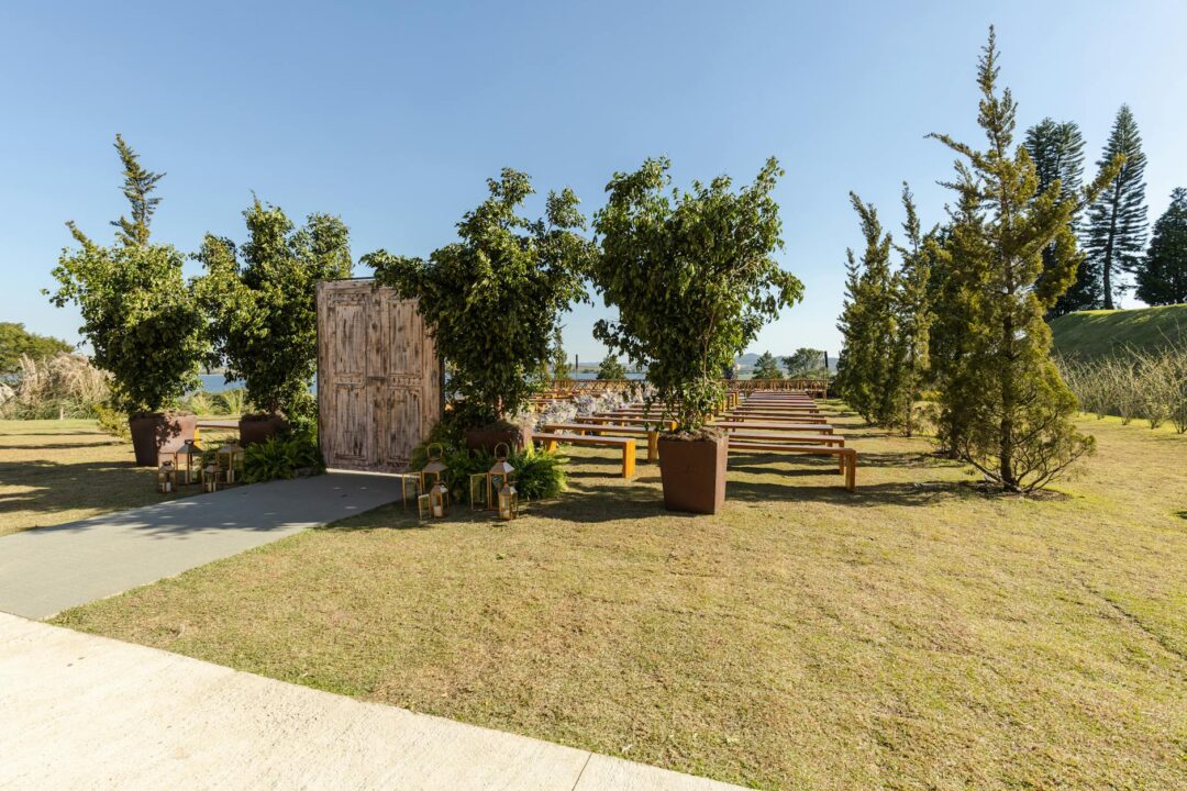 tree planting wedding ceremony outdoors, couple pressing soil around a sapling