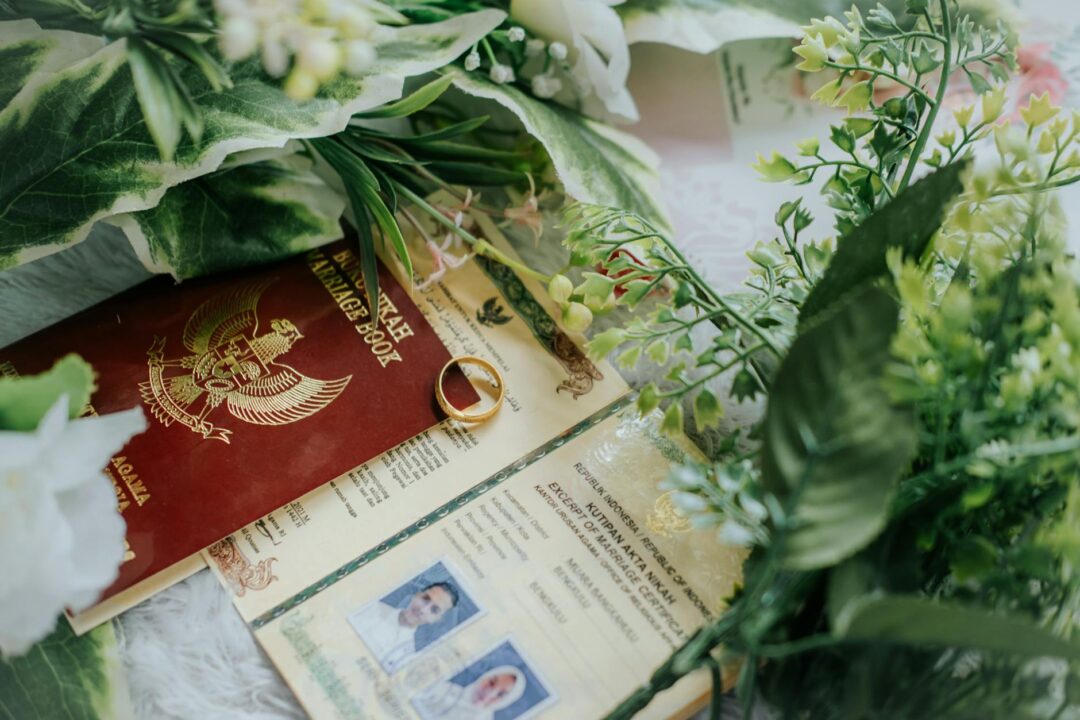 Close-up of a marriage certificate and wedding rings on a table, natural light, detail shot conveying the legal formality of an Australian w
