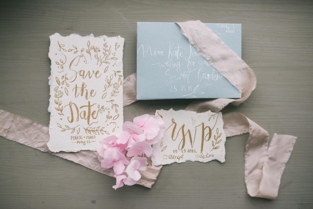 Gold foil wedding invitation with eucalyptus on cream linen