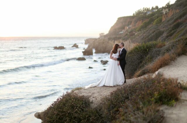 Malibu cliffside wedding ceremony at golden hour
