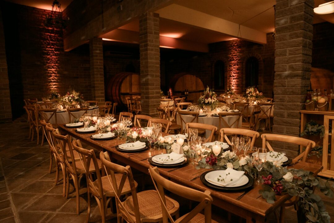 Rustic winery wedding reception with stone arches