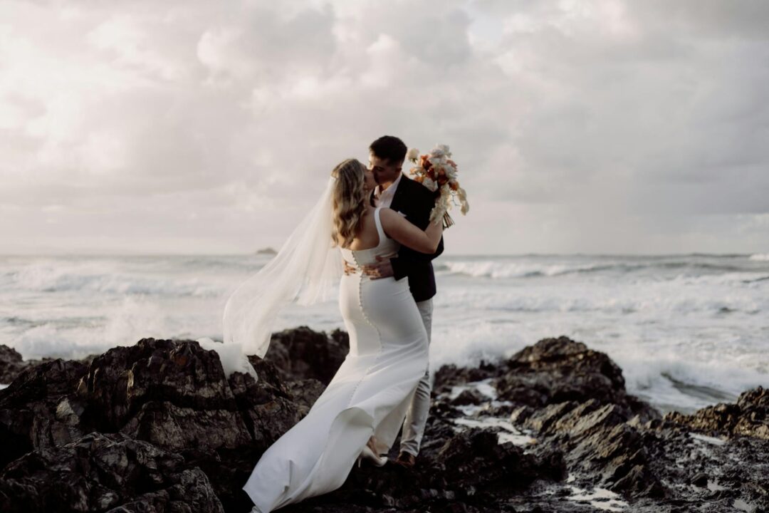 Coastal wedding ceremony with Pacific Ocean horizon backdrop